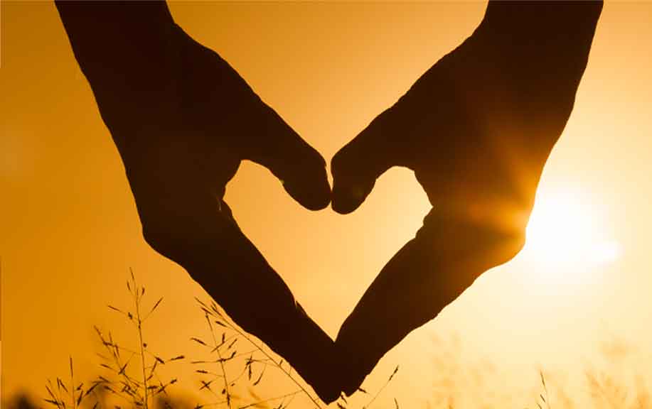 Hands formed in the shape of a heart